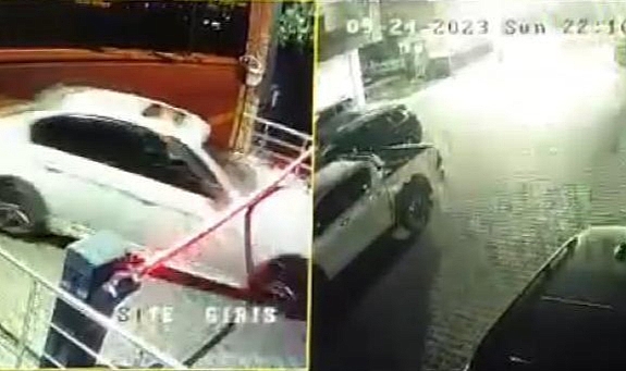 Polislerin ateş ederek durdurmaya çalıştığı şüpheli araç, siteye dalarken güvenlik kamerasına yansıdı
